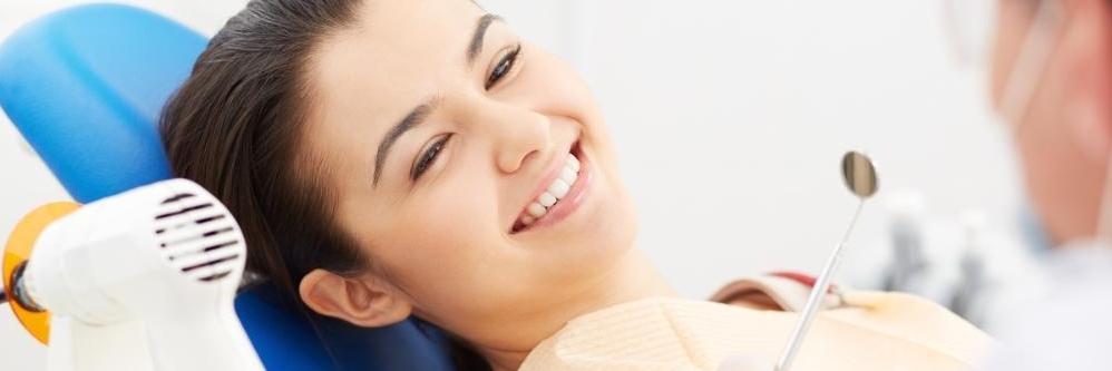 woman smiling sitting in the dental chair at the dentist doylestown