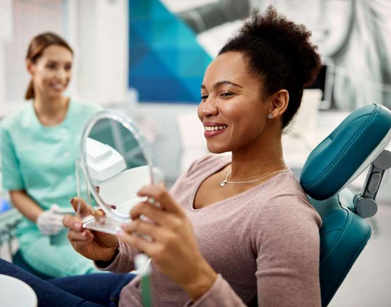 woman checking for dental inlays at dentist Doylestown PA
