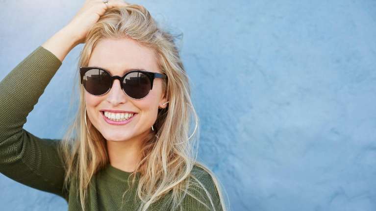 Woman in Doylestown confidently smiling with her white teeth