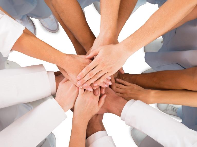hands joining together